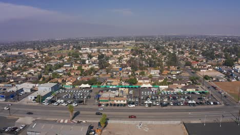 Aerial-wide-shot-of-an-industrial-working-class-community-on-a-hazy-day-in-Southern-California