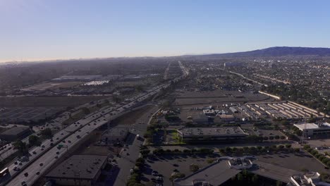 Aerial-shot-flying-over-the-110-Freeway-with-Long-Beach-in-the-far-distance