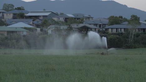 Sprinkler-In-Field-Watering-Plants---Mount-Warning-In-Tweed-Range,-Australia---Closed-Due-To-Coronavirus-Pandemic---slow-motion