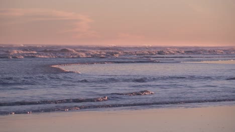 Scenery-Of-Rolling-Waves-Splashing-Through-Coastline-During-Sunset-Slow-Motion---Static-Shot