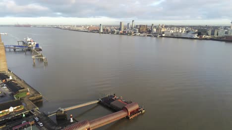 Woodside-ferry-village-terminal-aerial-view-Birkenhead-Liverpool-harbour-skyline-descend-pan-left