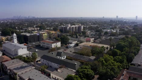Aerial-panning-shot-above-West-Hollywood-with-Downtown-Los-Angeles-in-the-distance