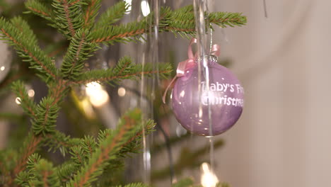 Close-up-of-shiny-decoration-ball-in-Christmas-tree,-close-shot