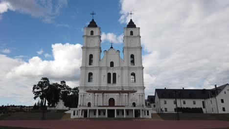 Exterior-Of-Basilica-Of-The-Assumption-Of-Aglona-With-White-Clouds-In-Background-In-Latvia,-Europe