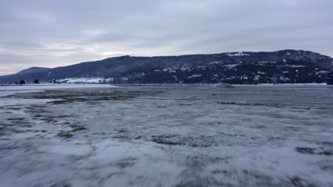 Drone-speeding-over-a-frozen-shore