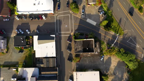 Cars-And-Traffic-On-The-Streets-In-Old-Town-Bandon,-Oregon---aerial-drone,-top-down