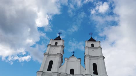 Roman-Catholic-Basilica-Of-The-Assumption-Of-Blessed-Virgin-Mary-In-Aglona,-Latvia-Against-Blue-Cloudy-Sky