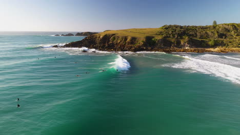 Amazing-drone-shot-of-surfers-and-waves-at-Coffs-Harbour-Emerald-Beach