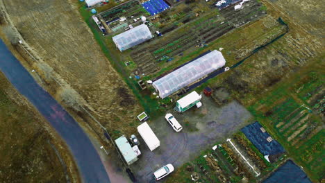 Aerial-view-when-car-is-driving-to-farm-yard