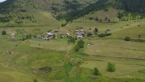 Ticje-Polje-traditional-old-cottage-village-huts-in-Serbia,-aerial-view