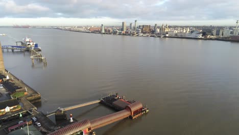 Woodside-ferry-village-terminal-aerial-lowering-view-Birkenhead-Liverpool-harbour-skyline