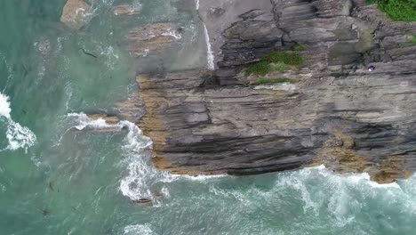 Flying-down-on-ocean-rock-formation