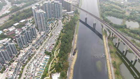Aerial-view-of-an-MTR-Train-bridge-crossing-in-Sha-Tin,-Hong-Kong