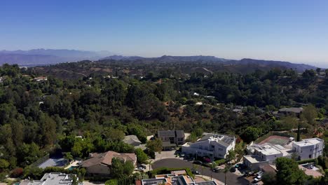 Aerial-shot-panning-above-Sherman-Oaks-hills-with-Downtown-Los-Angeles-in-the-distance
