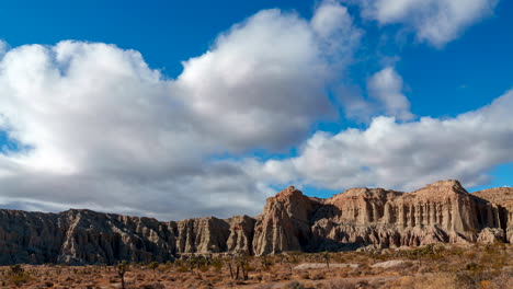 Dramatic-cloudscape-over-the-rugged-terrain-of-Red-Rock-Canyon-State-Park---static-wide-angle-time-lapse