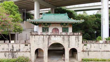 Pok-Ngar-Villa-ornate-gatehouse-remains,-Sha-Tin-area-in-Hong-Kong,-Aerial-view
