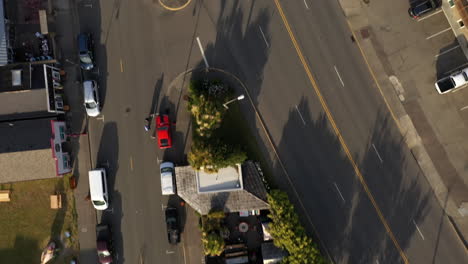 Aerial-View-Of-Cars-Parked-Outside-Business-Establishments-In-A-Small-Town-In-Bandon,-Oregon-At-Daytime---top-down-drone