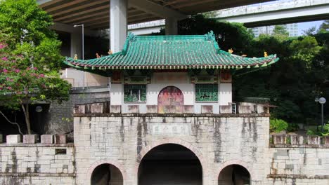 Pok-Ngar-Villa-ornate-gatehouse-remains,-Sha-Tin-area-in-Hong-Kong,-Aerial-view