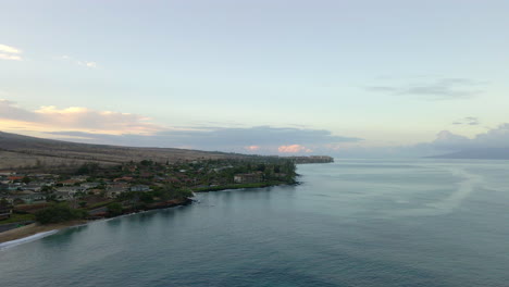 Aerial-panorama-of-West-Maui-coast-with-oceanfront-resorts-at-sunrise