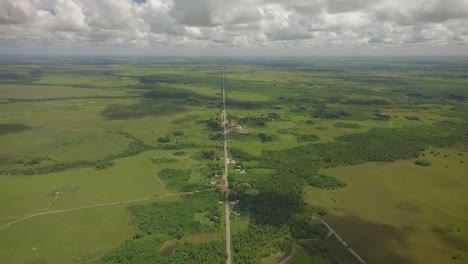 From-the-top-view-of-a-long-straight-road-across-a-green-savanna