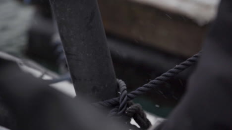 Securely-gripping-anchor-rope-for-boats-in-extreme-winter-closeup