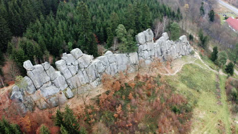 Aerial-Shot-Of-Rock-Wall-Amongst-Green-Forest,-Popular-Tourist-Destination-In-Czech-Republic