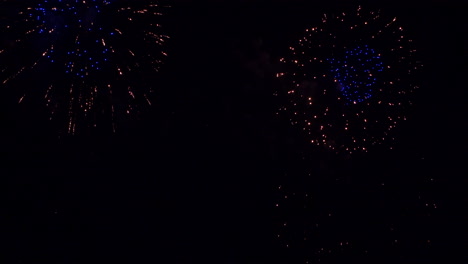 Fireworks-in-dark-sky-background.-Low-angle