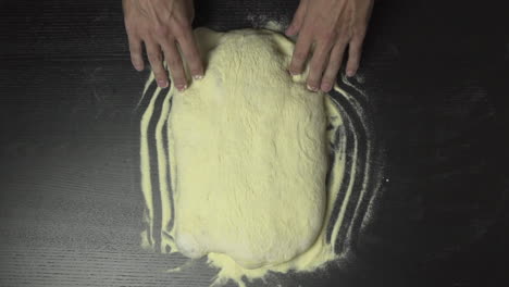 Slow-motion-of-a-baker-stretching-pizza-dough