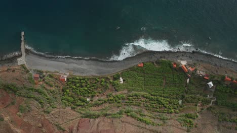 Secluded-farmland-Faja-dos-Padres-on-low-shore-of-Madeira,-aerial