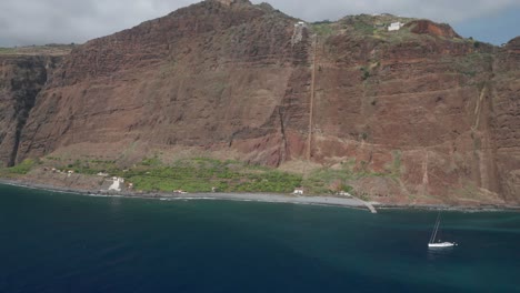 Scenic-steep-rock-face-of-touristic-island-Madeira-in-Atlantic-Ocean,-aerial