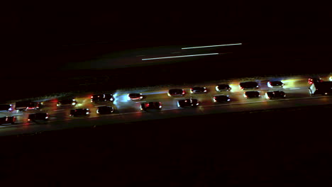 Night-drone-hyper-lapse-of-slow-moving-traffic-on-the-Interstate
