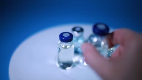 Antivirus-bottles-spinning,-a-woman-takes-one-bottle