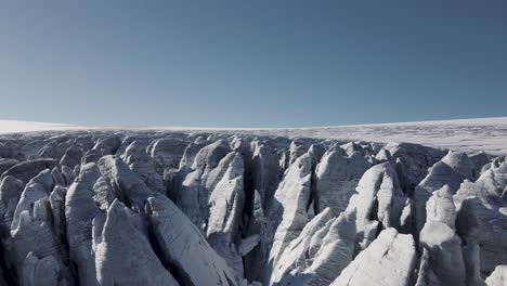 Aerial-ascending-reveal-shot-of-the-Buerbrenn-Glacier-in-Folgefonna,-Norway