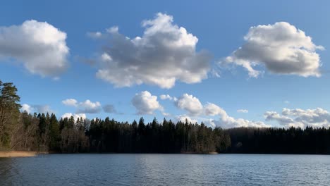 Camping-Site-By-Tranquil-Lake-Under-Cloudy-Blue-Sky---Wide-Shot