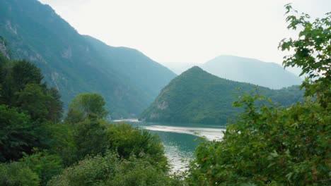 River-Drina-and-Lake-Perućac-through-Serbian-mountainside,-aerial-view