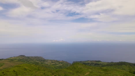 Aerial-landscape-of-Maui-mountain-hiking-trail,-island-shore-and-ocean