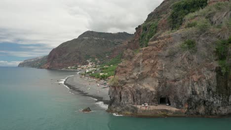 Natural-cliffs-of-Madeira-Island-with-grey-beaches-on-shores,-aerial