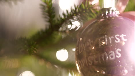 Happy-family-celebrating-newborn-baby,-Christmas-tree-decoration
