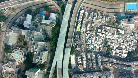 Downtown-Hong-Kong-city-skyscrapers-and-urban-traffic,-Aerial-view