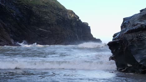 close-up-shot-of-waves-crashing-onto-a-sandy-beach