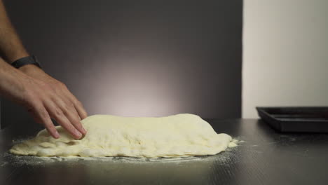 Slow-motion-of-a-baker-stretching-pizza-dough
