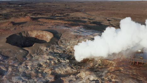 Gunnuhver-geyser-spraying-out-steam,-geothermal-landscape-in-Iceland