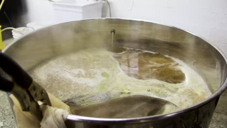Alcoholic-Beer-Frothing-and-Steaming-in-Pot-at-Local-Brewery