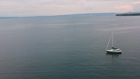 Aerial-views-of-a-yacht-sailing-in-Léman-Lake-in-Thonon,-France