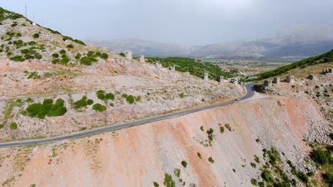 Aerial-Dolly-Back-View-Of-Curved-Winding-Road-On-Spinalonga-Island