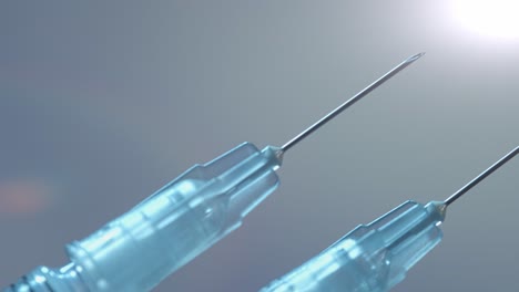 Two-syringes-for-both-doses-of-the-Covid-19-vaccine---close-up-sliding-isolated