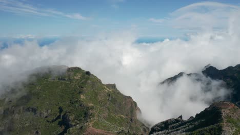 Dramatic-clouds-cover-mountainous-landscape-during-daytime-in-Madeira,-aerial