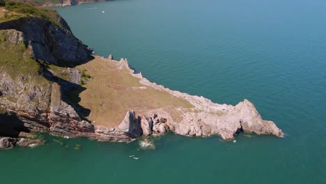Beautiful-landscape-with-rock-formation-with-Long-Quarry-Point-in-Torquay-and-wide-coastline-in-background