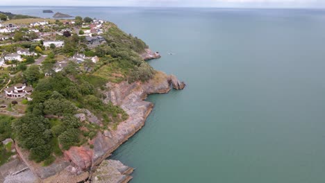 Coastal-Town-of-Torquay,-England---Aerial-View-Above-Rocky-Sea-Cliffs