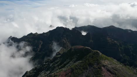 Heavenly-scenery-with-white-clouds-above-mountainous-Pico-Ruivo-in-Madeira